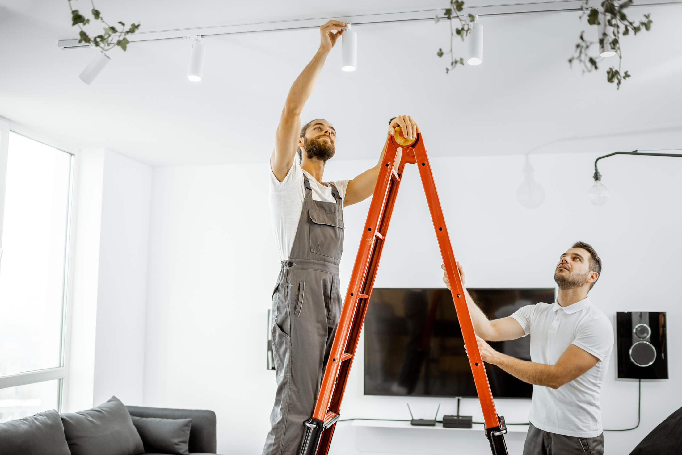 Men Installing Lights at Home